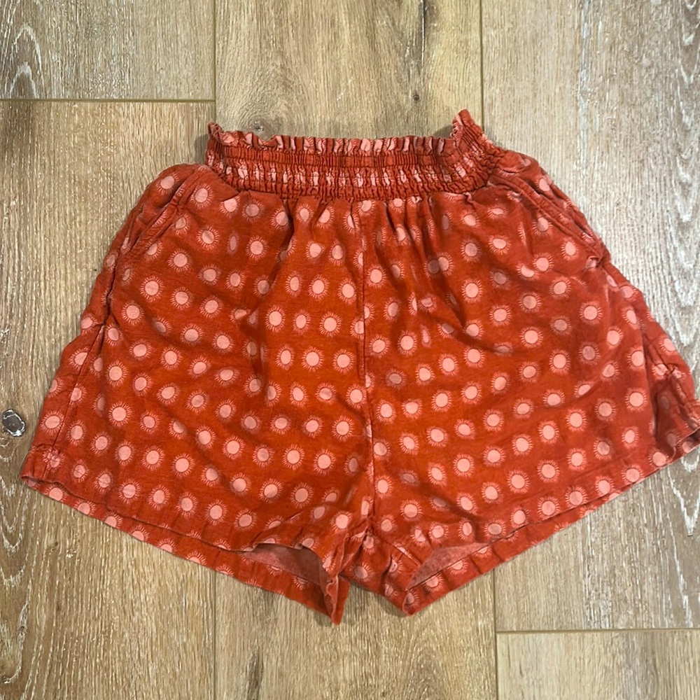 Sun pattern copper colored shorts